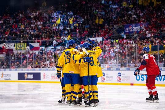 Players of Sweden celebrate the 3-0 goal by Nils Höglander