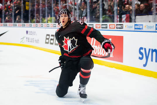 Dylan Cozens of Canada celebrates
