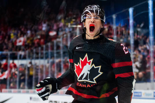 Dylan Cozens of Canada celebrates