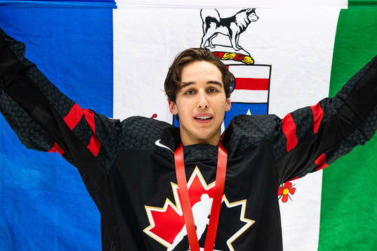 Dylan Cozens of Canada celebrates