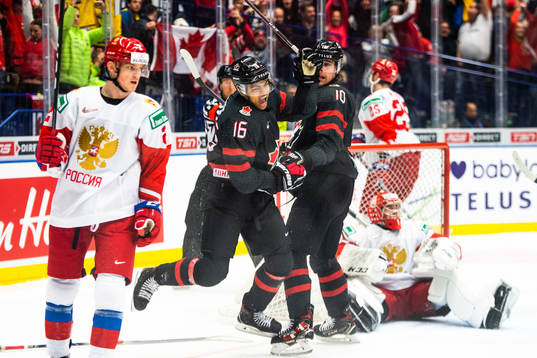 Akil Thomas and Raphael Lavoie of Canada celebrate the 4-3