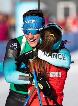 A handout photo made available by the Olympic Information Service of the International Olympic Committee show Mathieu Garcia FRA is embraced by Jeanne Richard FRA as they win the Gold Medal with in the Biathlon Single Mixed Relay at Les Tuffes Nordic Centre in France. The Winter Youth Olympic Games, Lausanne, Switzerland, Sunday 12 January 2020. 