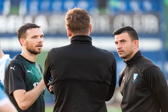 Marcus Berg of Krasnodar talking to goalkeeper Johan Dahlin and Behrang Safari of Malmö FF