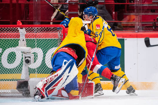 Goaltender Lars Johansson of Sweden in a collision with