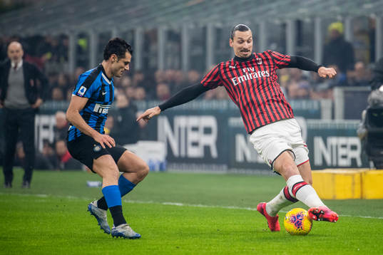 Antonio Candreva of Inter and Zlatan Ibrahimovic of Milan