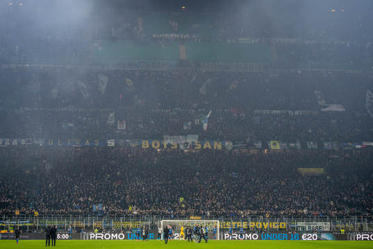 Players of Inter celebrate in front of their supporters
