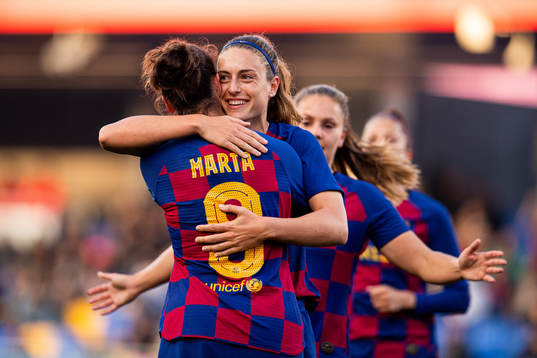 Alexia Putellas of Barcelona celebrates with teammate Marta