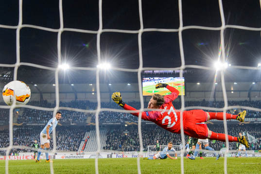 Goalkeeper Johan Dahlin of Malmö FF sees 0-1 pass him by