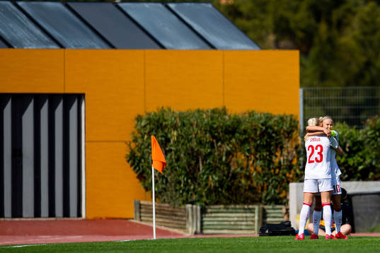 Pernille Harder of Denmark celebrates with teammate Sofie Svava after scoring 1-0