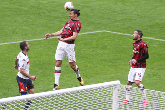Zlatan Ibrahimovic of Milan and Antonio Biraschi of Genoa