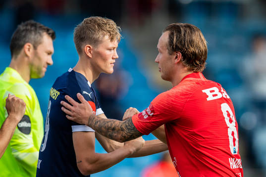 Halldor Stenevik of Strømsgodset and Fredrik Haugen of