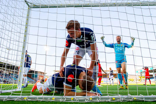 Sondre Fosnæss Hanssen and goalkeeper Viljar Myhra of Strømsgodset react after teammate Niklas Gunnarsson saves an attempt on the line