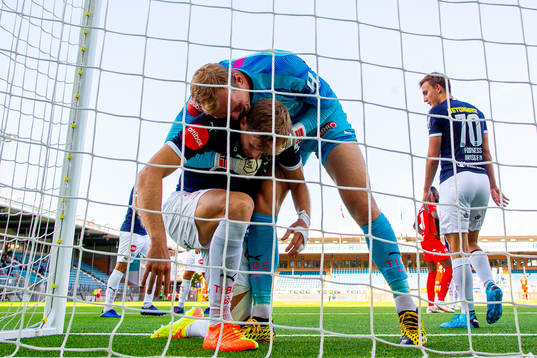Goalkeeper Viljar Myhra of Strømsgodset celebrates after teammate Niklas Gunnarsson saves an attempt on the line