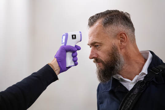 Swedish journalist Olof Lundh has his temperature checked ahead of entering the venue of the Swedish national football team’s press conference on August 31, 2020 in Stockholm.