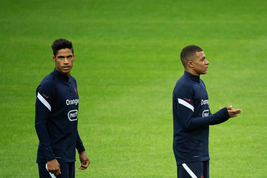 Raphaël Varane and Kylian Mbappé of the French national