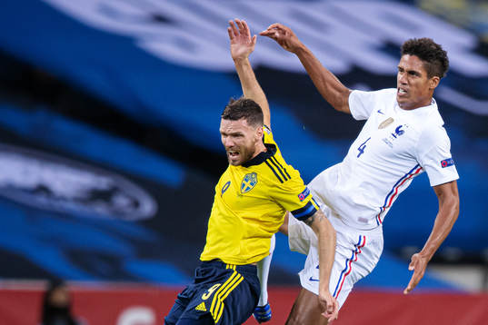 Marcus Berg of Sweden and Raphaël Varane of France