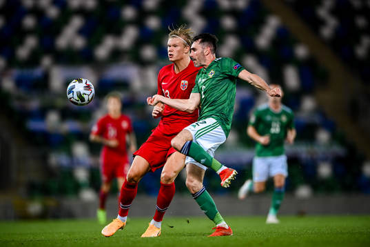 Erling Braut Haaland of Norway and Michael Smith orthern