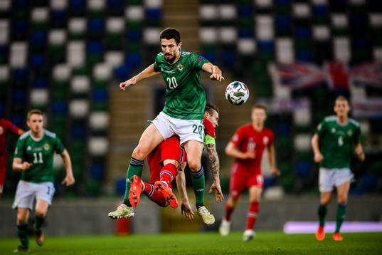 Craig Cathcart of Northern Ireland against Stefan Johansen of Norway