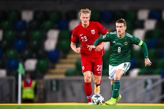 Erling Braut Haaland of Norway and Steven Davis of Northern