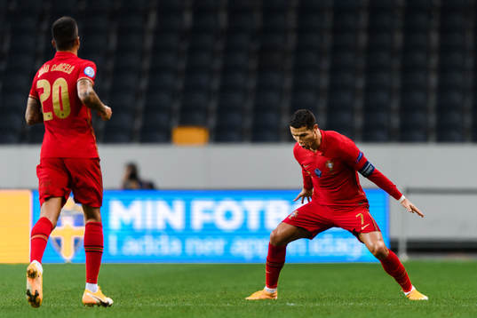 Joao Cancelo and Cristiano Ronaldo of Portugal celebrate