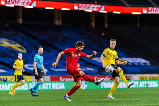 Ruben Neves of Portugal and Mattias Svanberg of Sweden