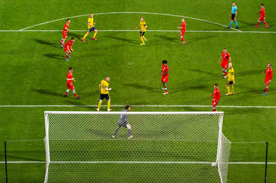 Felix Beijmo of Sweden scores 4-0 behind goalkeeper Tom