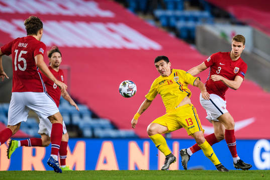 Claudiu Keseru of Romania and Kristoffer Ajer of Norway