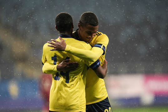 Paulos Abraham and Amin Sarr of Sweden celebrate the 9-0 goal