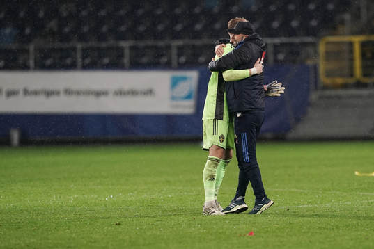 Goalkeeper Pontus Dahlberg and Peter Wennberg, assistant coach celebrate