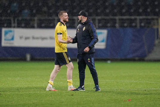 Thomas Isherwood and Peter Wennberg, assistant coach of Sweden celebrate