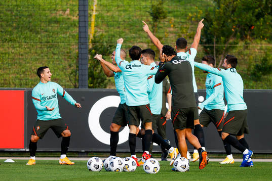 In this handout photo from the Portuguese football association, players of the Portuguese national football team reacts