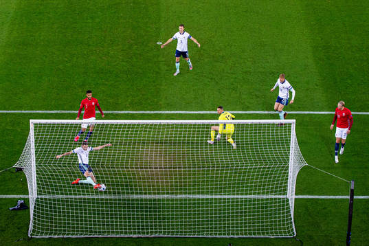 Tom Flanagan of Northern Ireland saves the attempt from