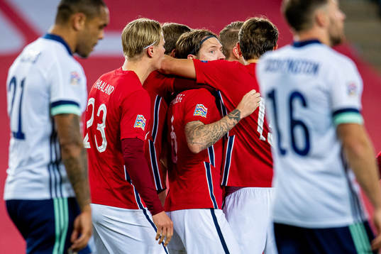 Stefan Strandberg of Norway celebrates with teammates
