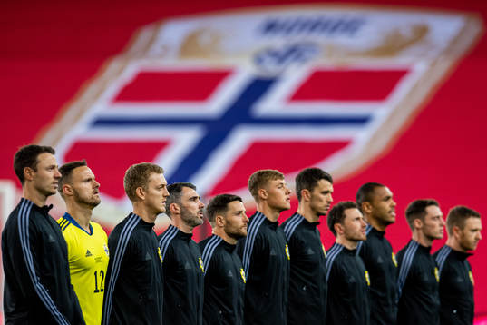 Michael Smith and the players of Northern Ireland line up