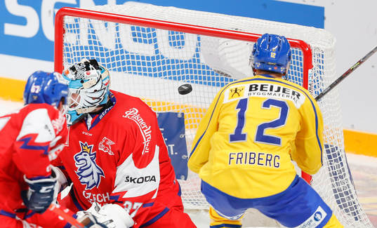 Max Friberg #12, SWE scores goal behind Patrik Bartosak