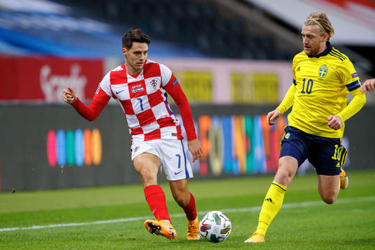 Josip Brekalo of Croatia and Emil Forsberg of Sweden