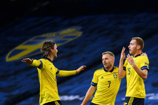 Kristoffer Olsson , Sebastian Larsson and Dejan Kulusevski of Sweden celebrate the 1-0 goal