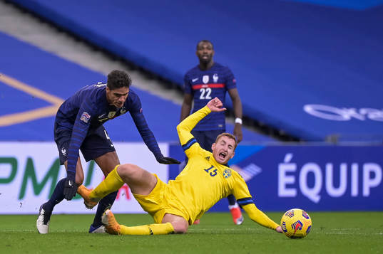 Raphael Varane of France and Dejan Kulusevski of Sweden