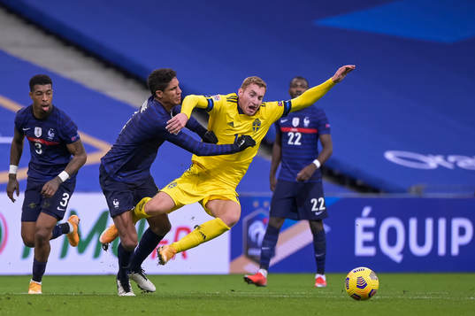 Raphael Varane of France and Dejan Kulusevski of Sweden