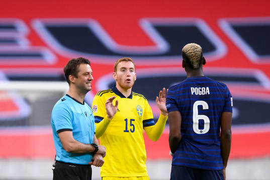 Dejan Kulusevski of Sweden and Paul Pogba of France