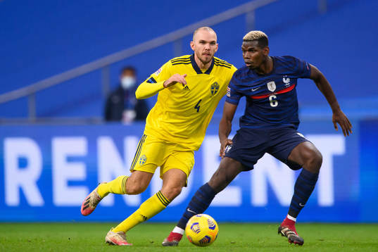 Marcus Danielson of Sweden and Paul Pogba of France