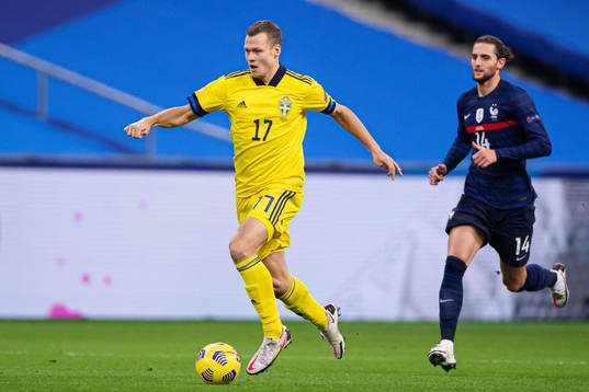 Viktor Claesson of Sweden in front of Adrien Rabiot of