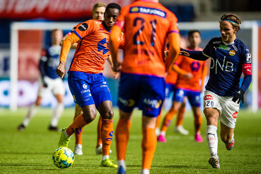 Parfait Bizoza of Aalesund and Mikkel Maigaard Jakobsen of Strømsgodset
