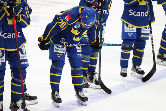 Lawrence Pilut of Sweden look dejected