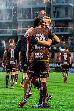 Sondre Johansen and Joackim Solberg of Mjøndalen celebrate