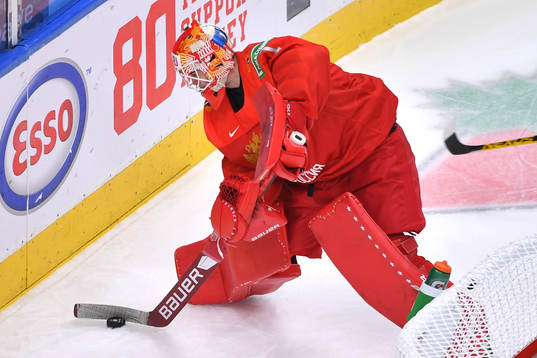 Yaroslav Askarov of Russia handles the puck behind his net