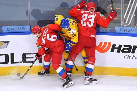 Simon Holmström of Sweden collides with Semyon Chistyakov