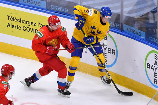 Emil Heineman of Sweden attempts to elude Vasili Ponomaryov