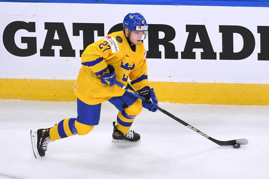 Zion Nybeck of Sweden skates with the puck