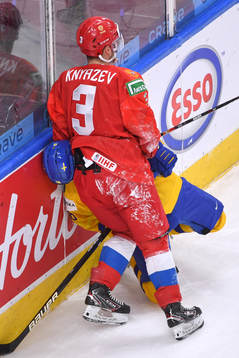 Artemi Knyazev of Russia pins the head of Lucas Raymond of